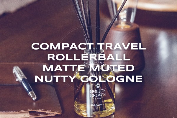 Compact travel rollerball matte muted nutty cologne